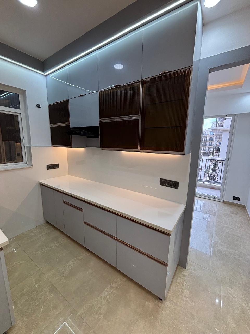 Compact modular kitchen with under-cabinet lighting