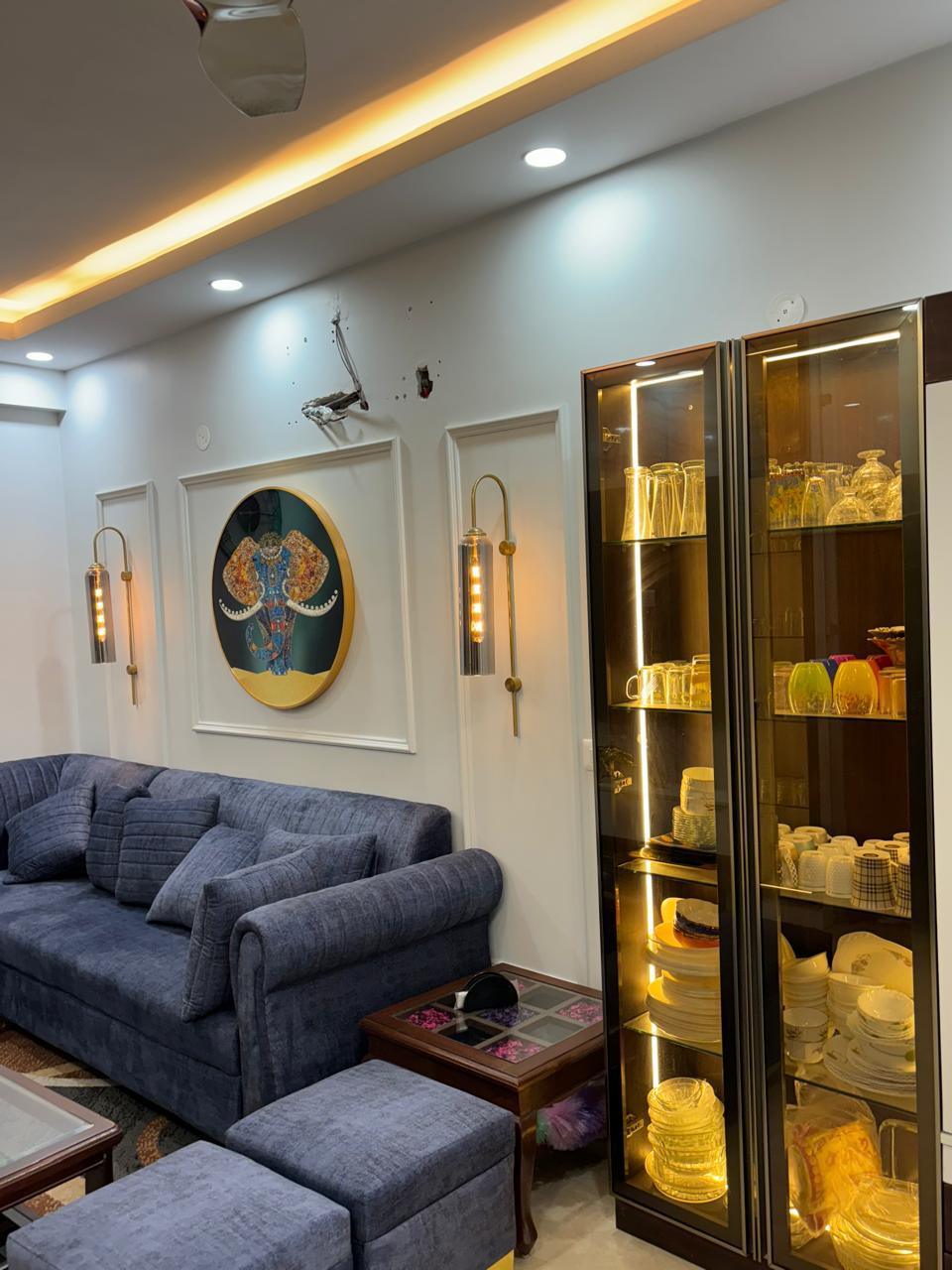 Living room seating with a lit crockery display unit