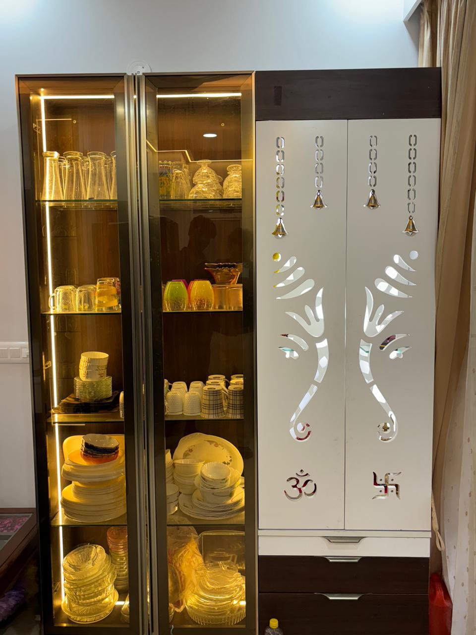 Open wardrobe interior with drawers and bronze fluted glass shutter