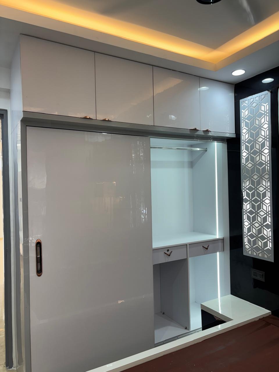 Open glossy white and grey wardrobe with dresser drawers